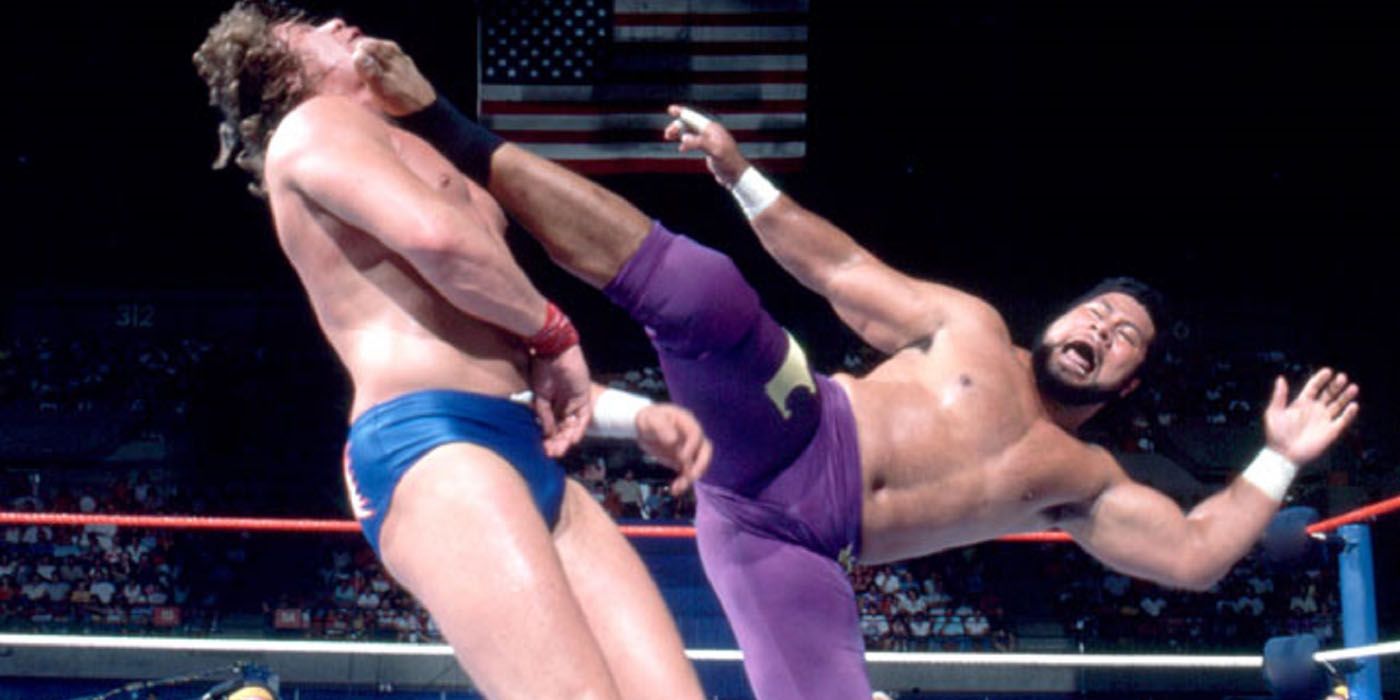 Haku kicking someone in WWE.