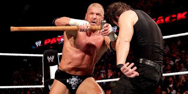 Triple H Hitting Dean Ambrose With A Sledgehammer