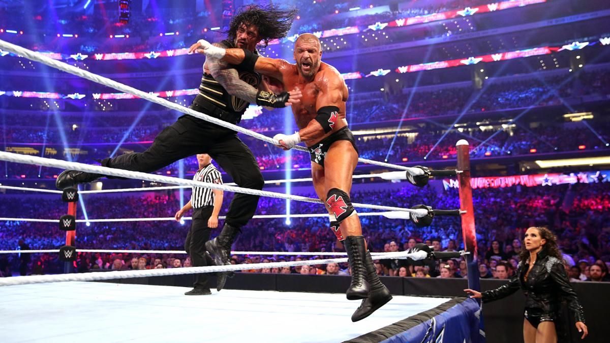 Roman Reigns Triple H wwe WM 32