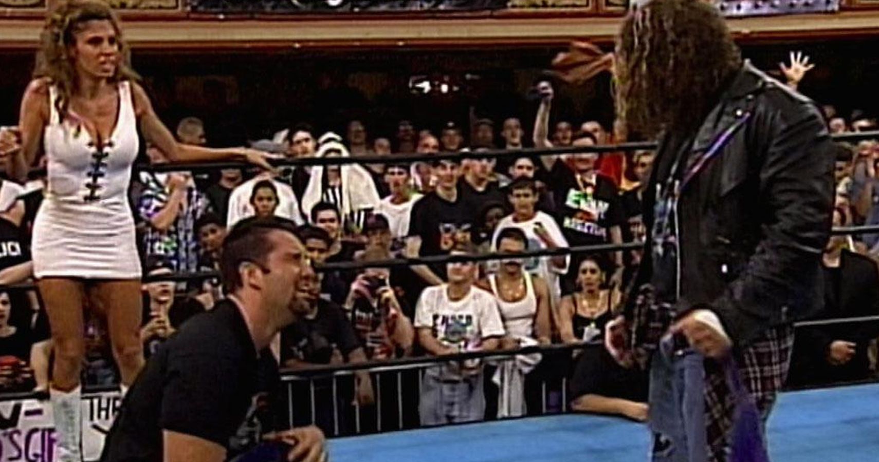 Francine looks on as Raven hands Tommy Dreamer the tag team titles