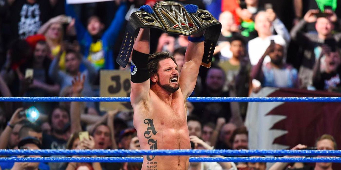 AJ Styles celebrating with the WWE Championship