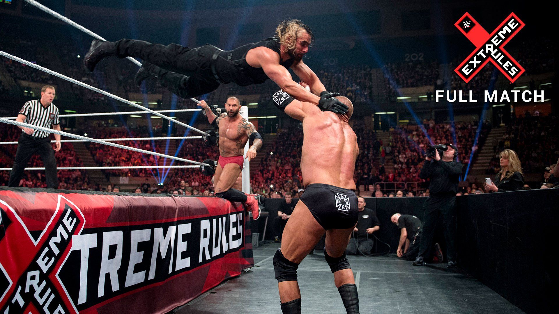 Seth Rollins dives on Triple H