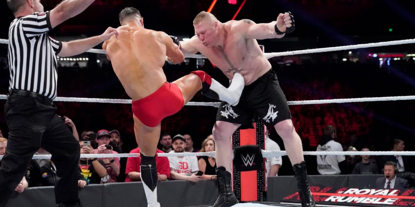 Finn Balor kicks Brock Lesnar