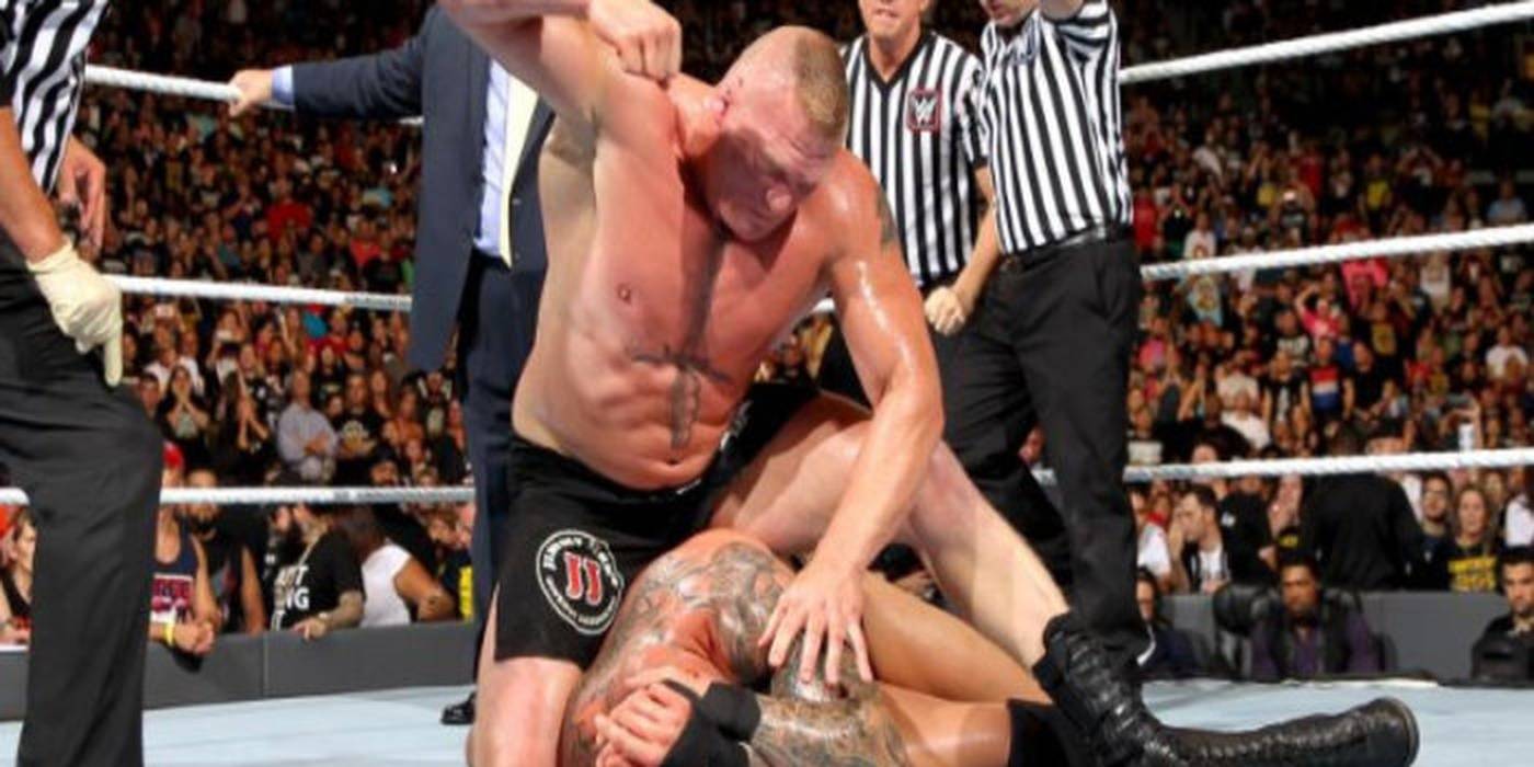 alt="Lesnar beating Orton"