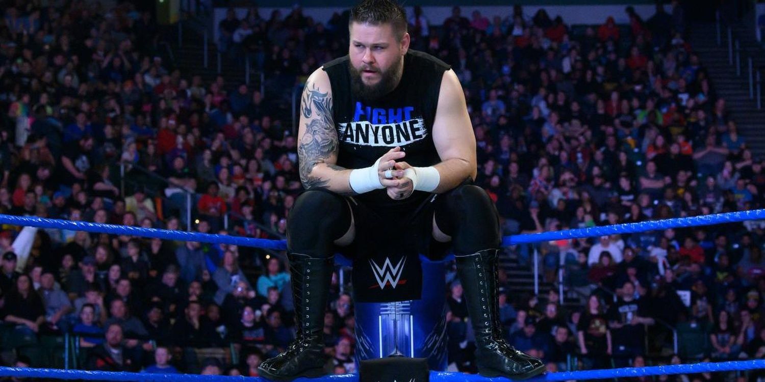 Kevin Owens sitting on the turnbuckle 