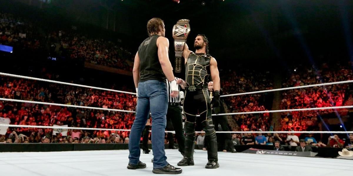 Seth Rollins shows off the WWE Title to Dean Ambrose