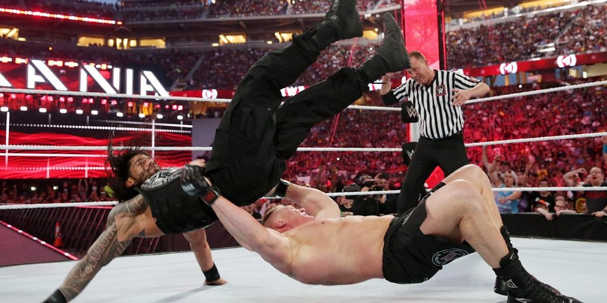 Brock Lesnar suplexes Roman Reigns