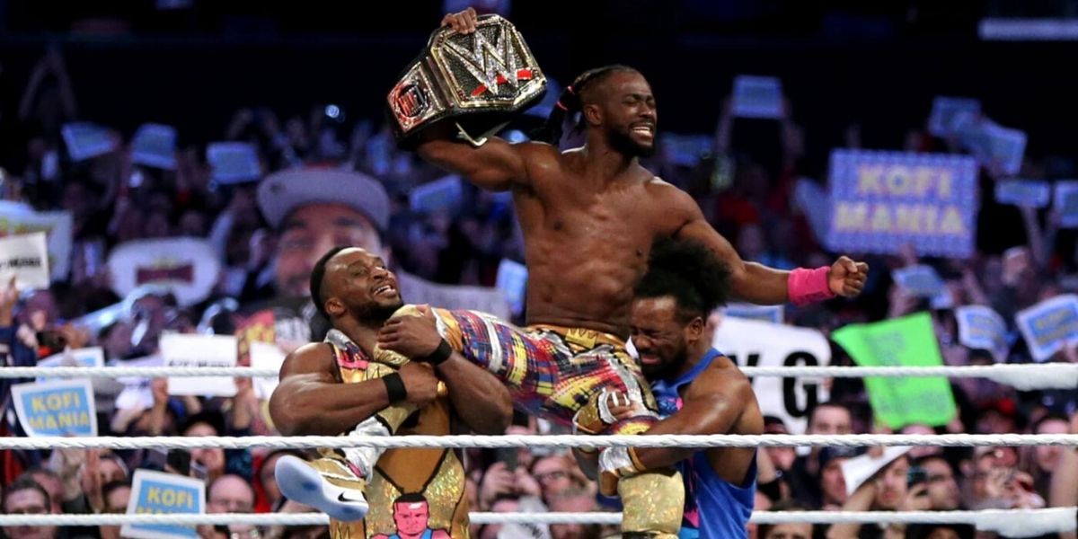 Kofi Kingston celebrates as WWE Champion on New Day's shoulders
