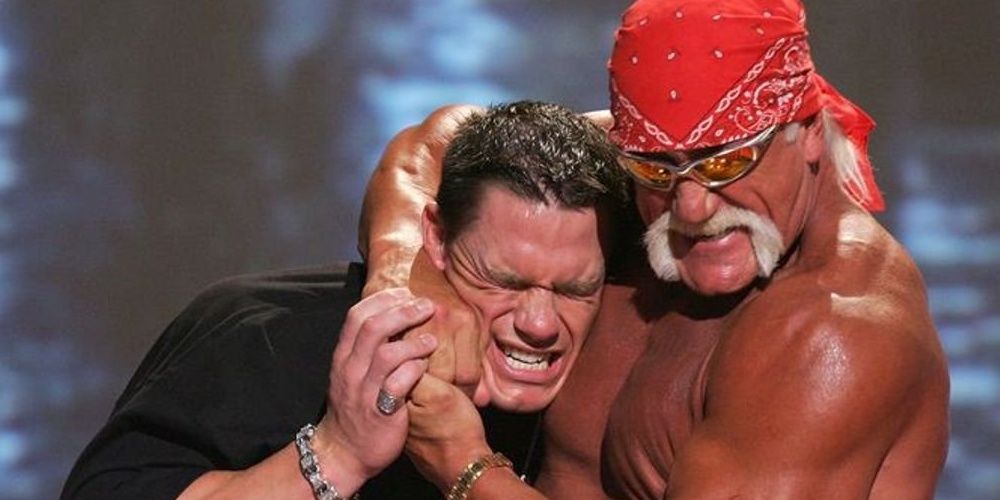 Hulk Hogan puts John Cena in a headlock
