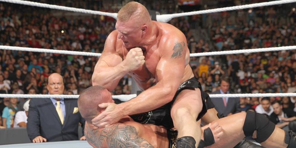 Brock Lesnar elbows Randy Orton 