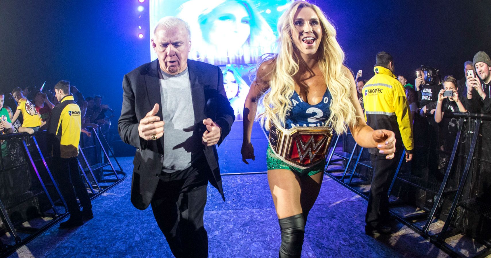 Ric and Charlotte Flair strutting