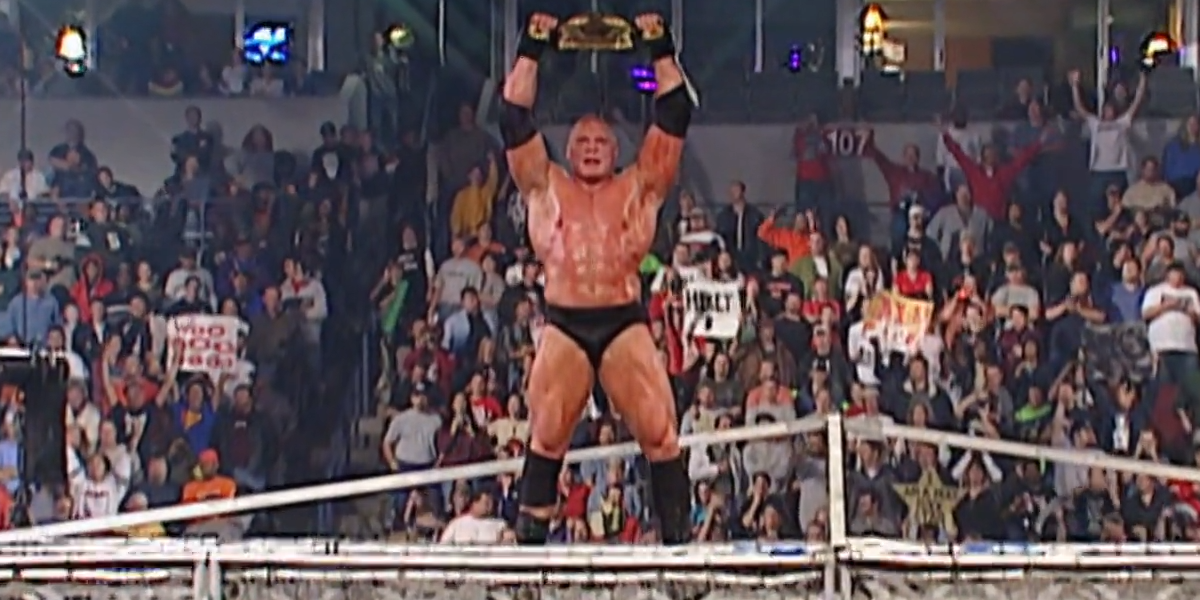 Lesnar celebrates after defeating The Undertaker at No Mercy 2002