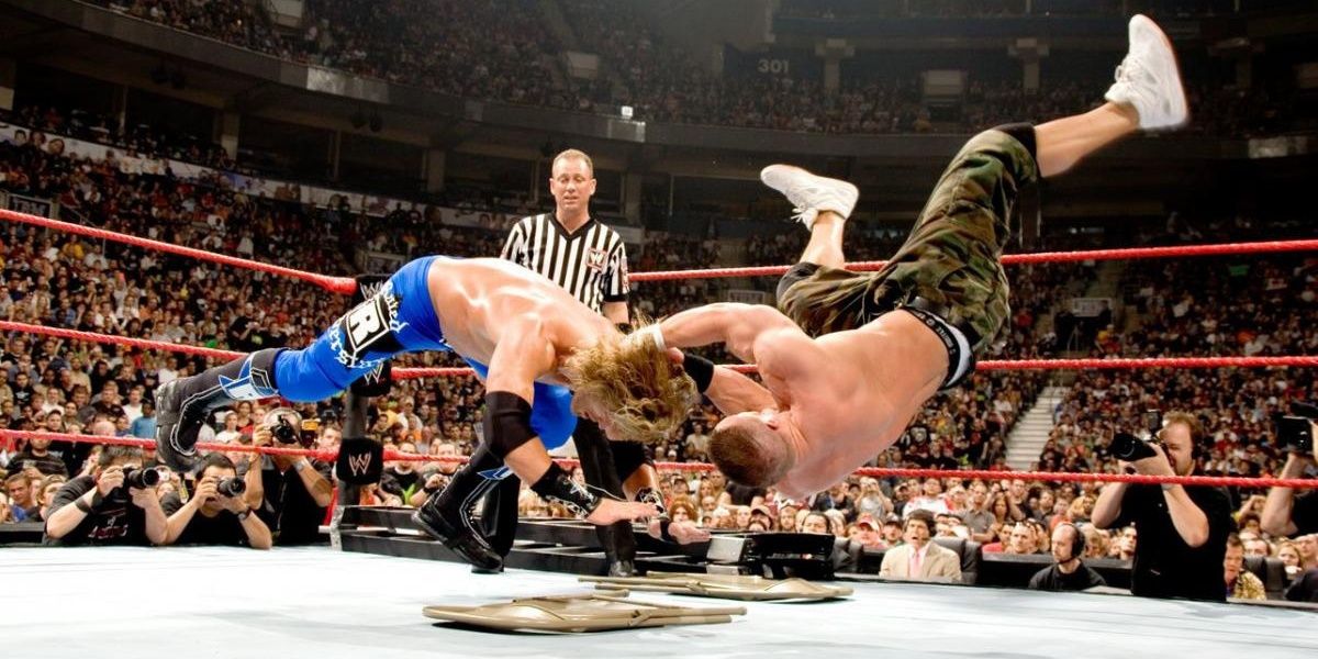 John Cena delivers a devastating move to his rival Edge