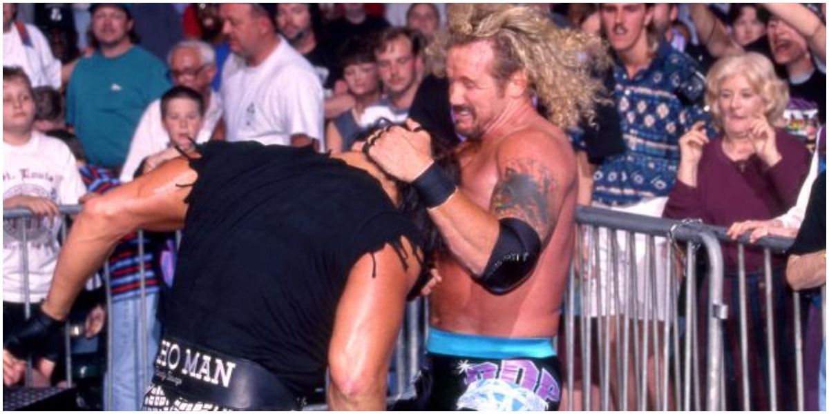 Randy Savage and Diamond Dallas Page fighting outside of ring