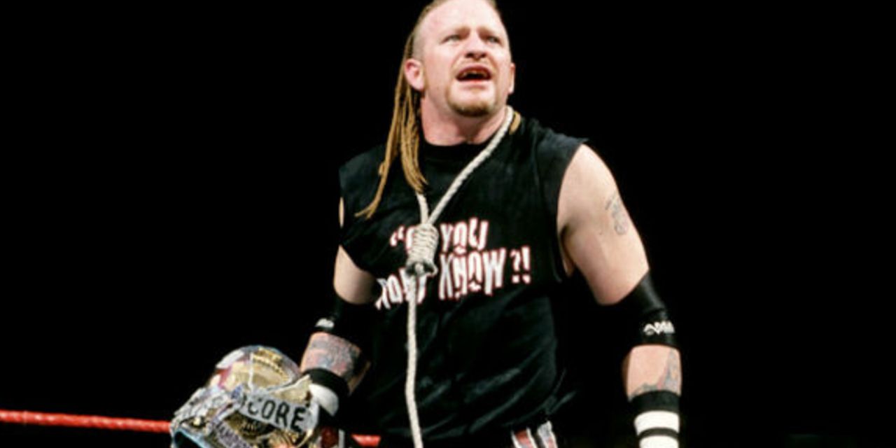 Road Dogg in the ring holding the Hardcore Title