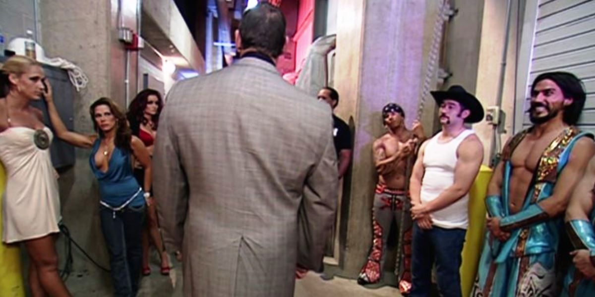 WWE Chairman Vince McMahon Walking Past A Few WWE Superstars