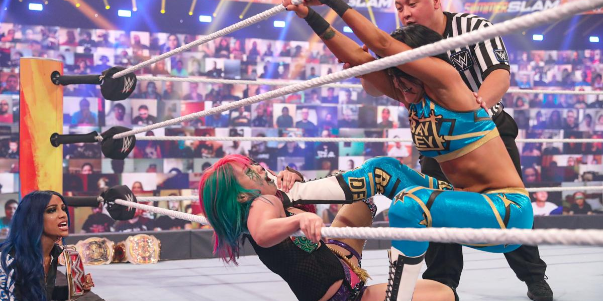 Bayley chokes Asuka with her foot