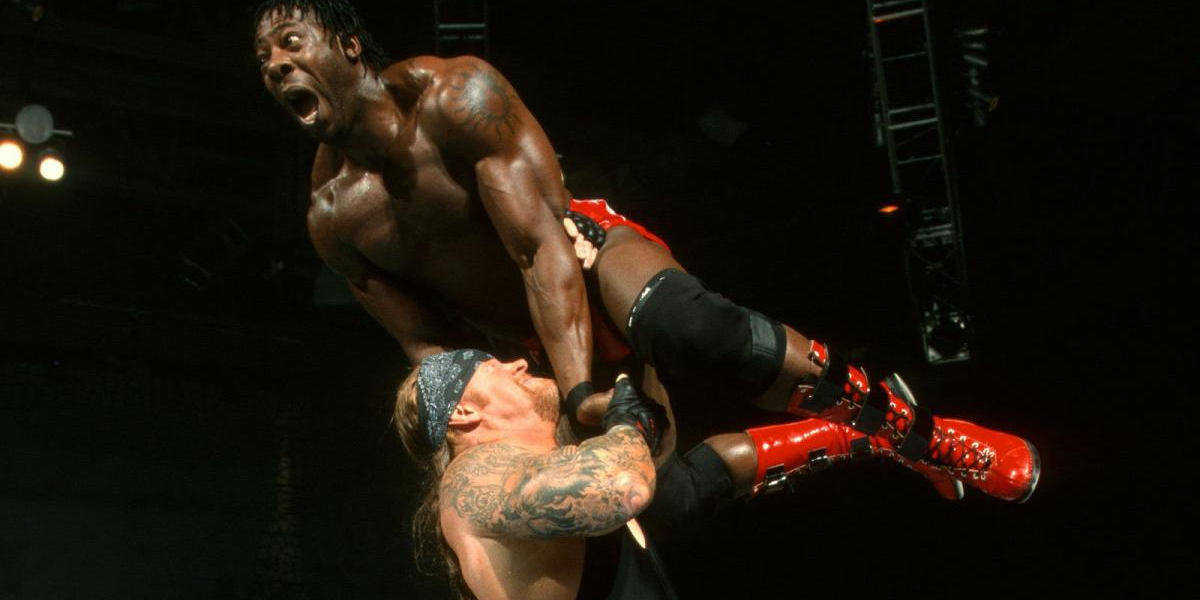 Undertaker throws Booker T around