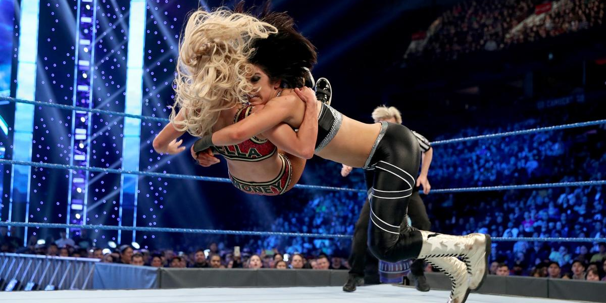 Bayley hits Carmella with the Bayley to Belly suplex