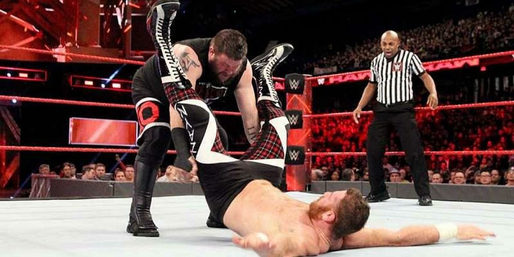 Kevin Owens delivering a Pop Up Powerbomb to Sami Zayn