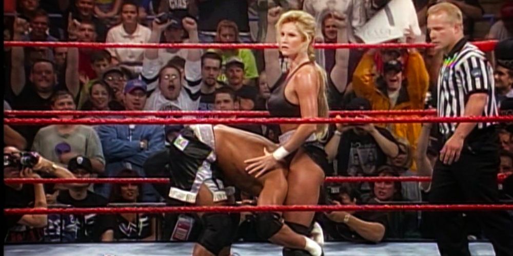 Sable setting Marc Mero up for a Sable Bomb.