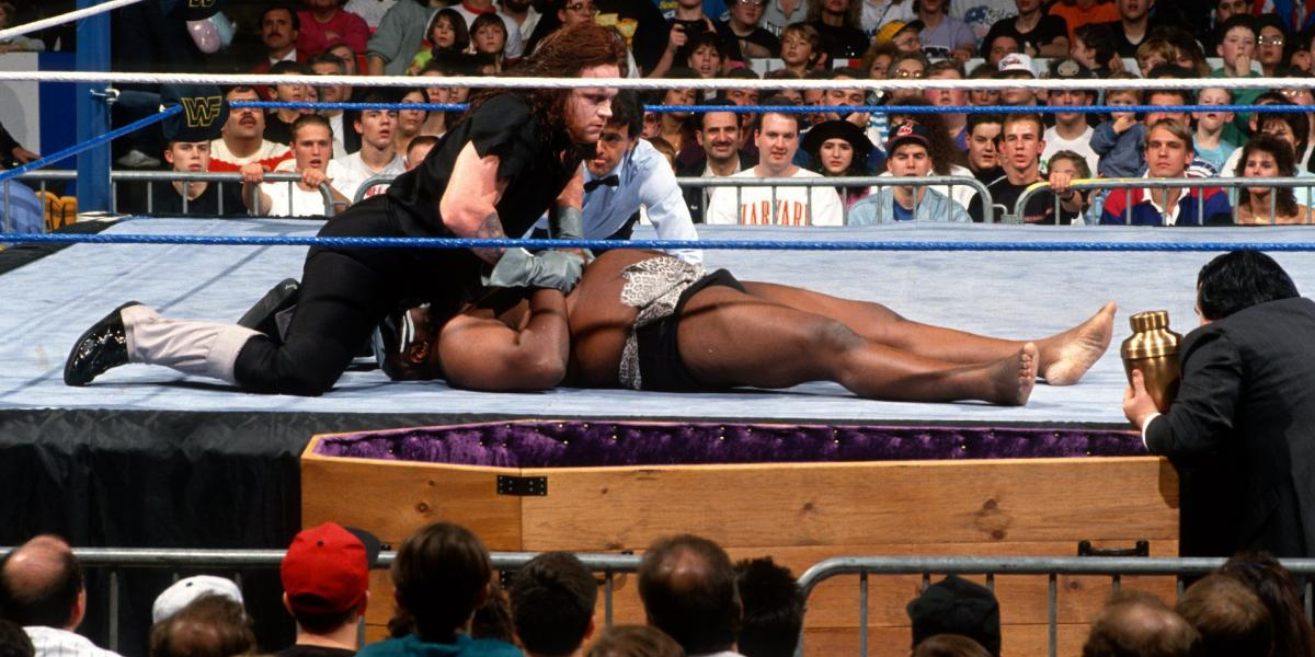 Undertaker pins Kamala in a Casket Match