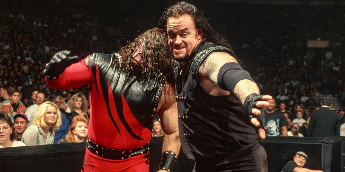 Undertaker smashes Kane's head into the steps