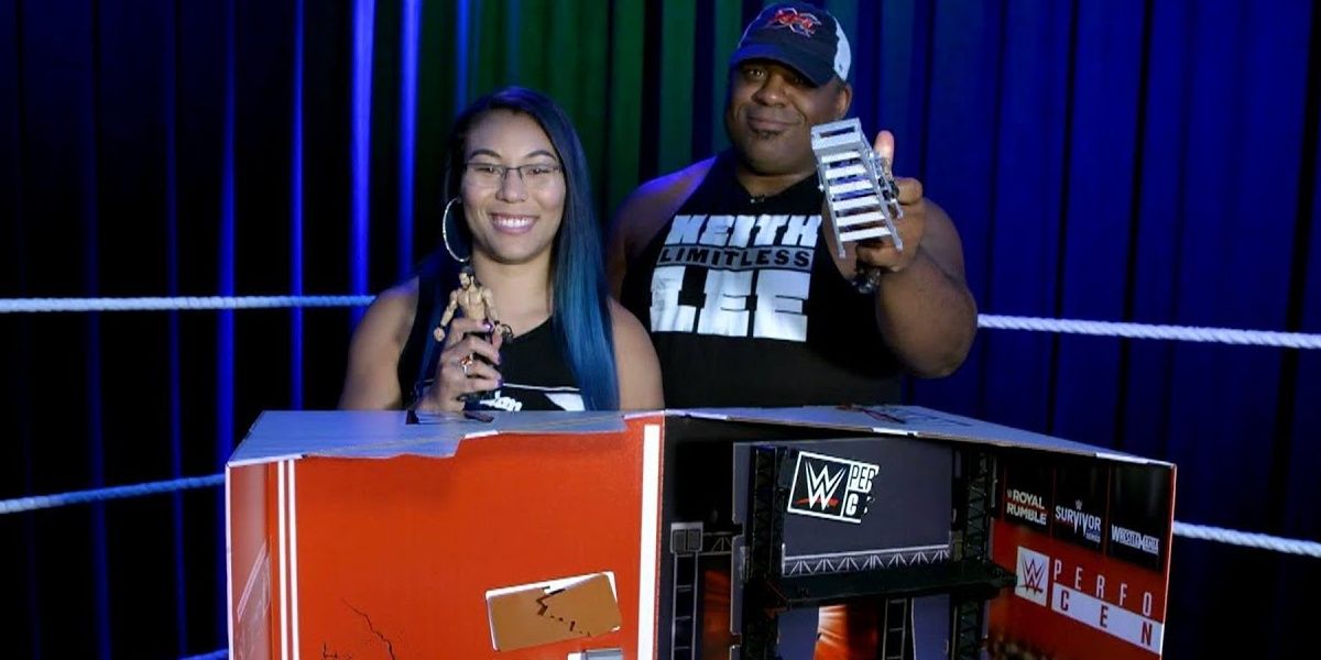 Keith Lee and Mia Yim with WWE toys