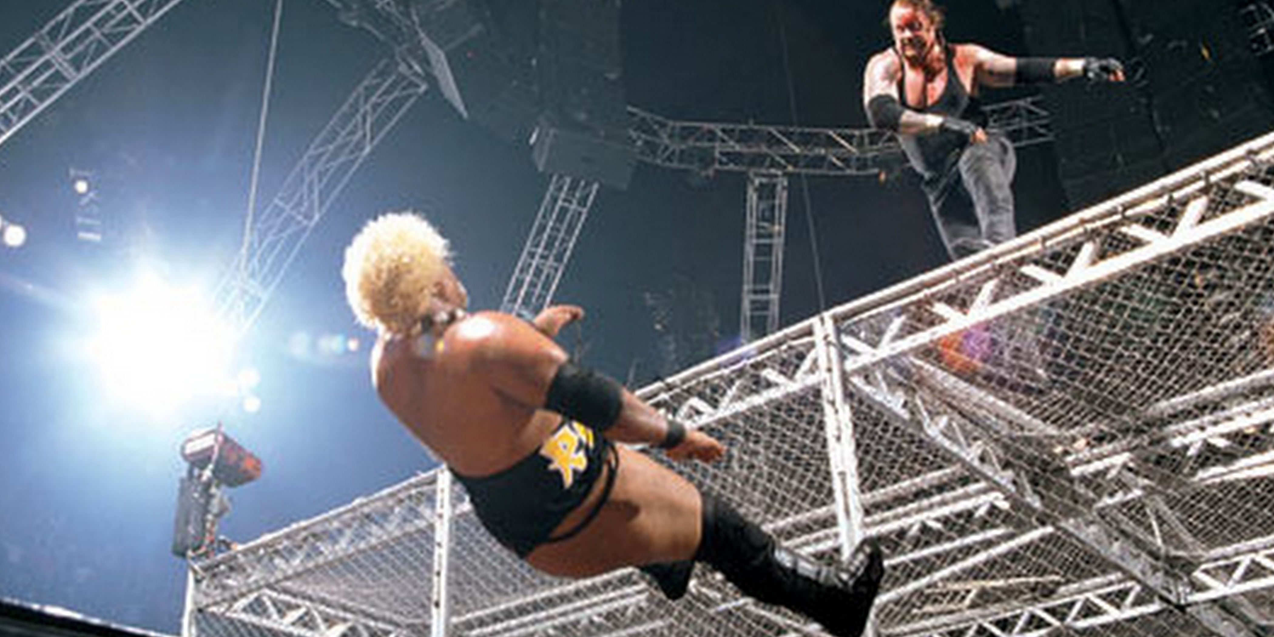 Rikishi falls from the roof of the cell