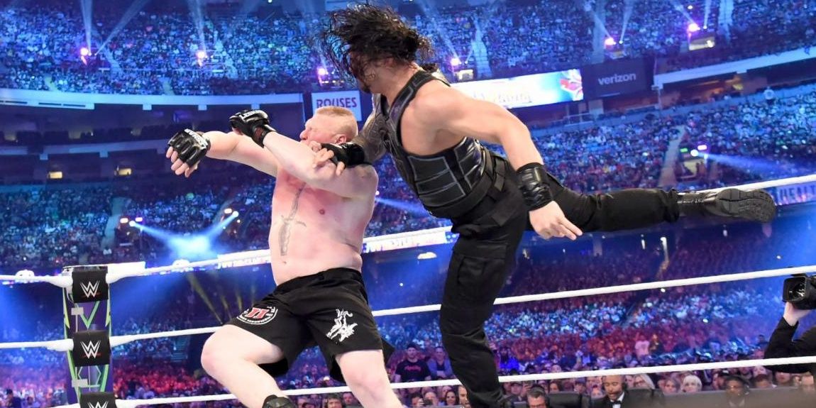 Roman Reigns hitting a superman punch on Brock Lesnar