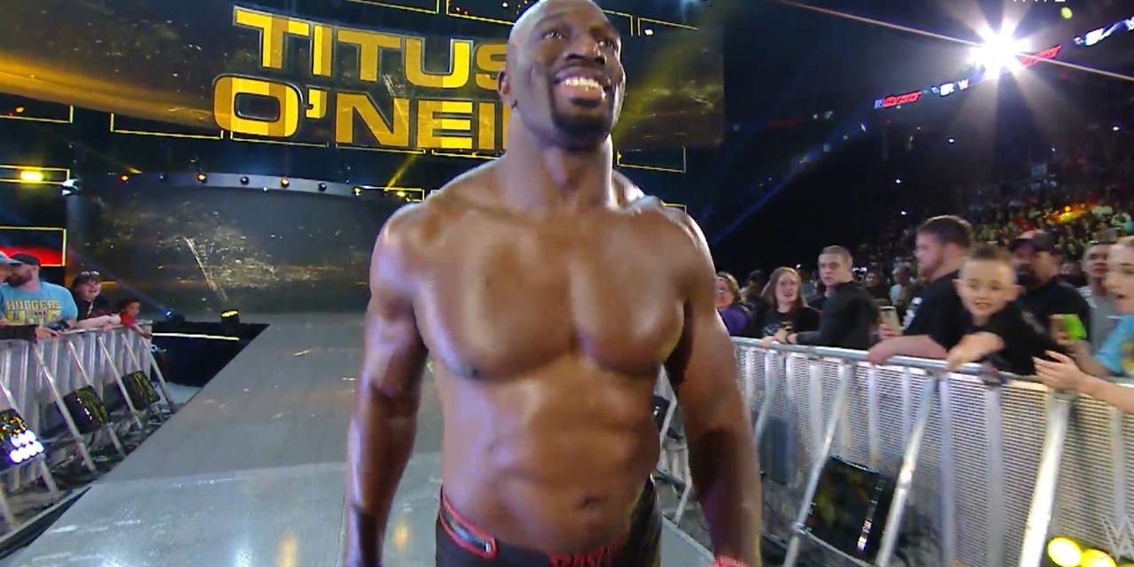 Titus O'Neil smiling as he walks towards the ring.