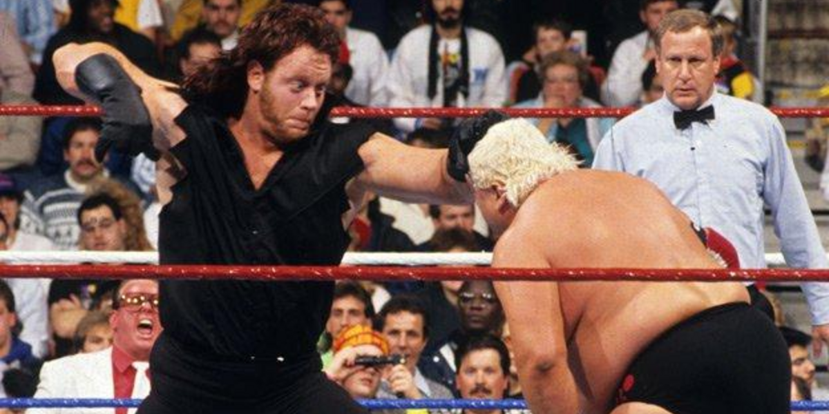 Undertaker punches Dusty Rhodes