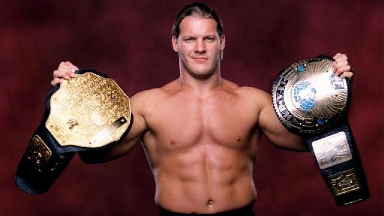 WWE Chris Jericho Holding Undisputed Championship Titles Posing For Photo