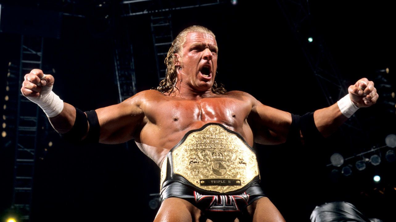 WWE Triple H Standing On Turnbuckle Wearing Heavyweight Championship Posing To Crowd