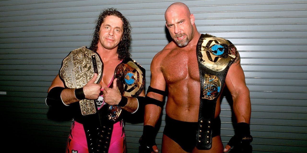 Bret Hart and Goldberg title pose