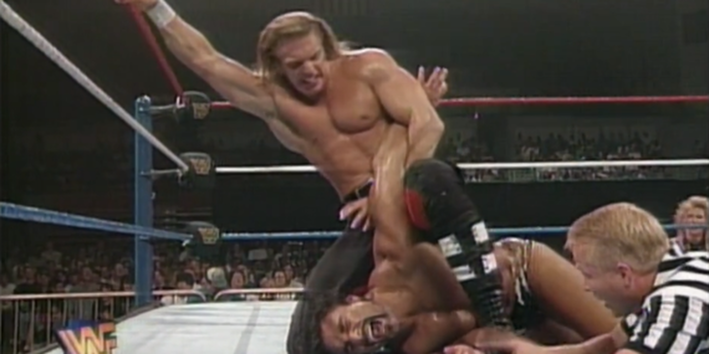 Triple H puts Marc Mero in an armbar