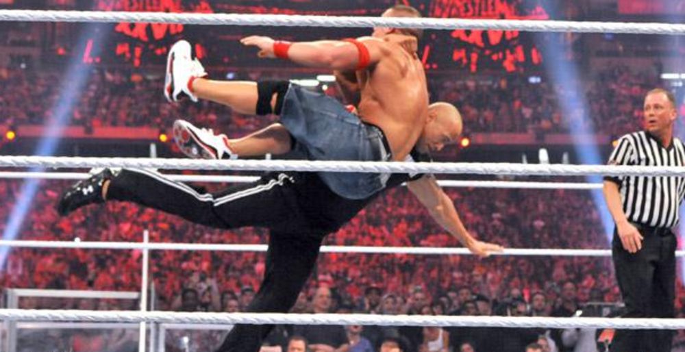 The Rock delivers a Rock Bottom to John Cena at WrestleMania 27