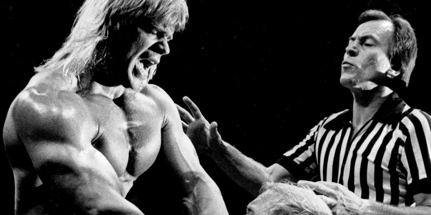 Tommy Young attempting to stop Lex Luger from choking Arn Anderson.