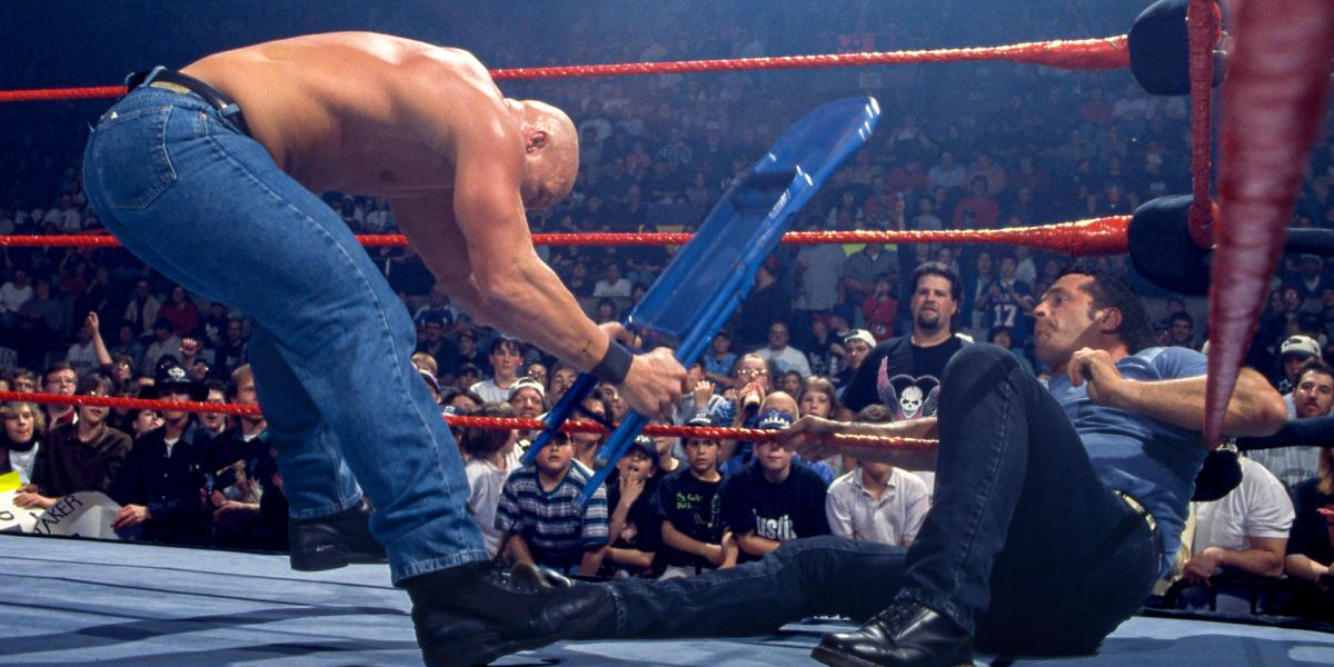 Stone Cold beats on Bret Hart with a chair