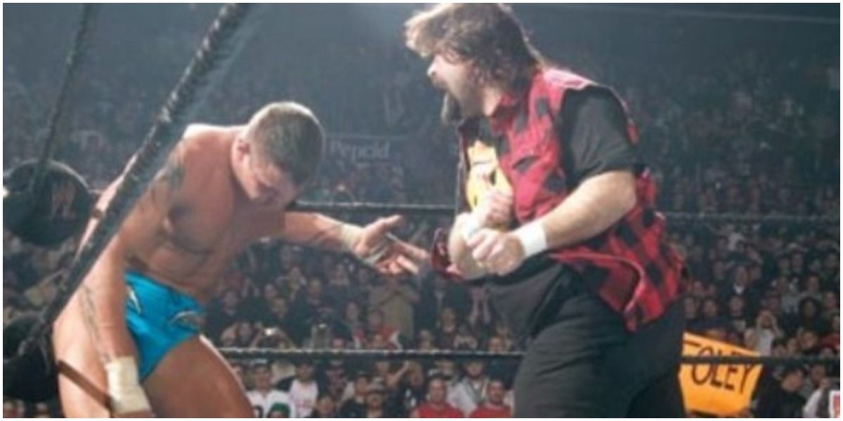 WWE Mick Foley Striking Randy Orton