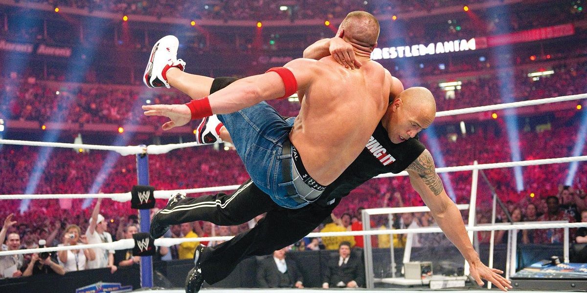 The Rock attacks John Cena