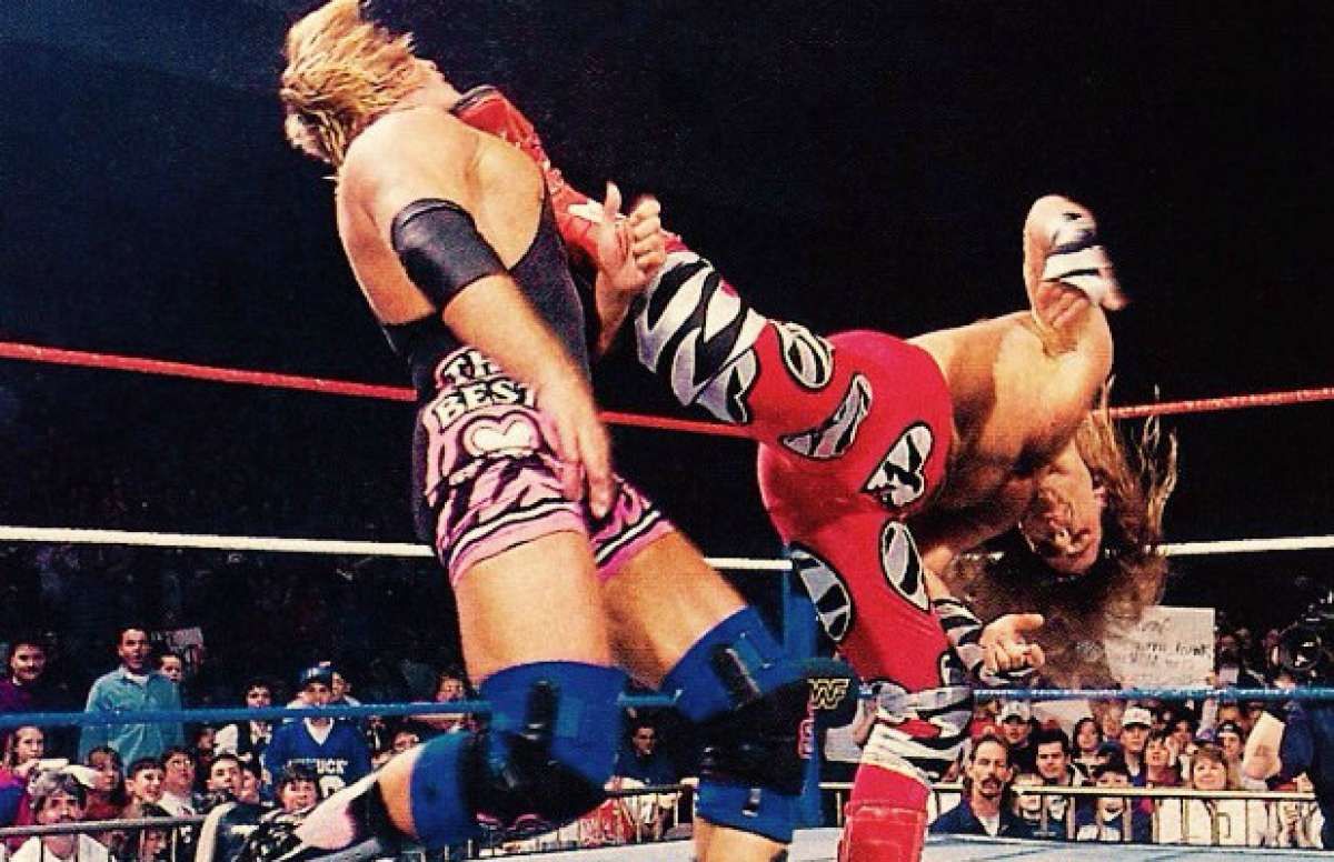 WWE Shawn Michaels Delivering Sweet Chin Music To Owen Hart