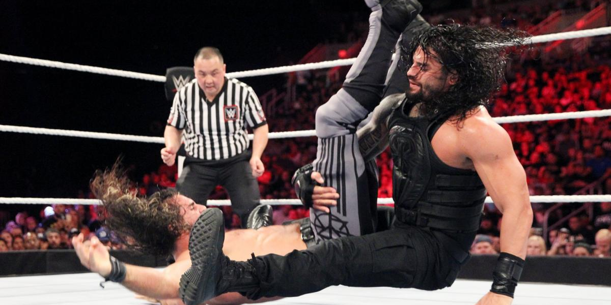 Roman Reigns powerbombs Seth Rollins
