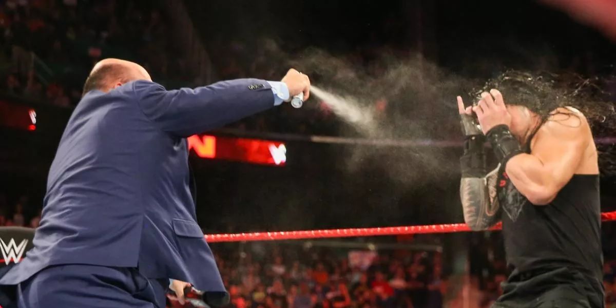  Paul Heyman sprays Roman Reigns