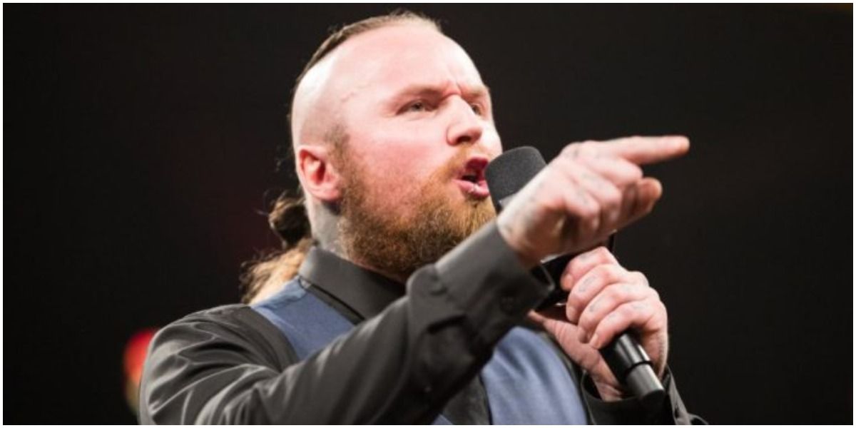 WWE Aleister Black Speaking Into A Microphone