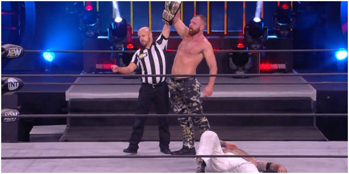 AEW Jon Moxley Holding The AEW World Championship Over The Butcher