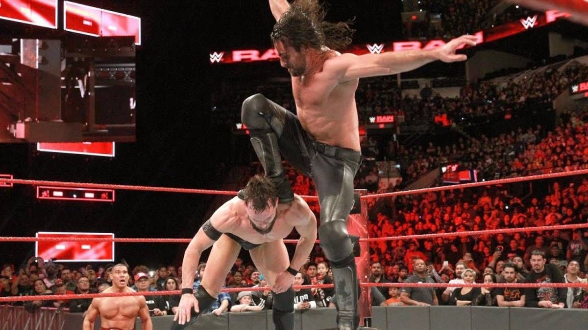 WWE Seth Rollins Delivering A Stomp On Finn Balor