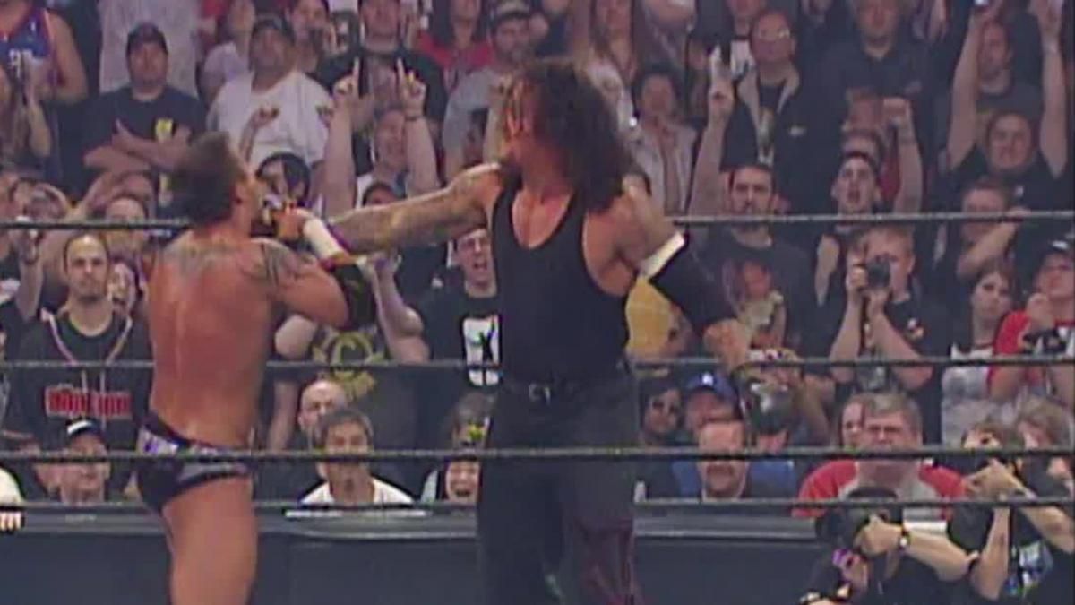 WWE Undertaker Holding Randy Orton For A Chokeslam