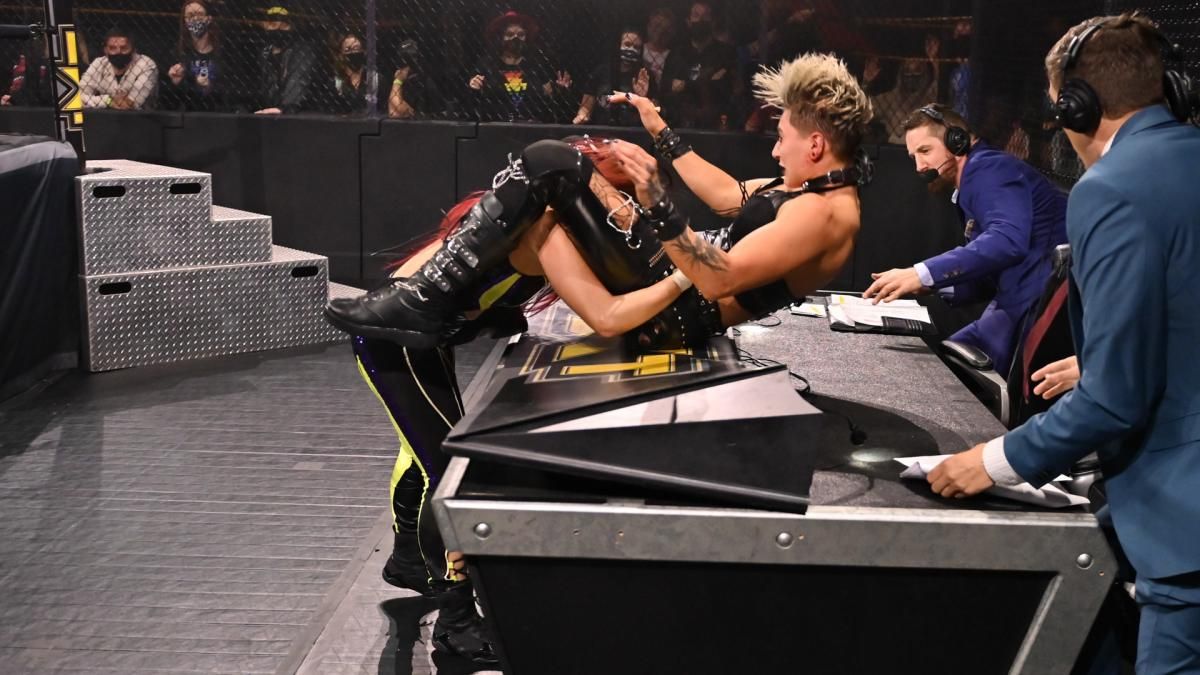 WWE Io Shirai Powerbombing Rhea Ripley Through Announcers Table