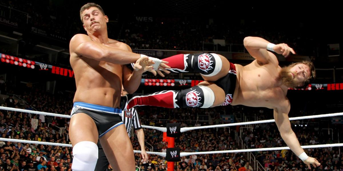 Daniel Bryan dropkicks Cody Rhodes